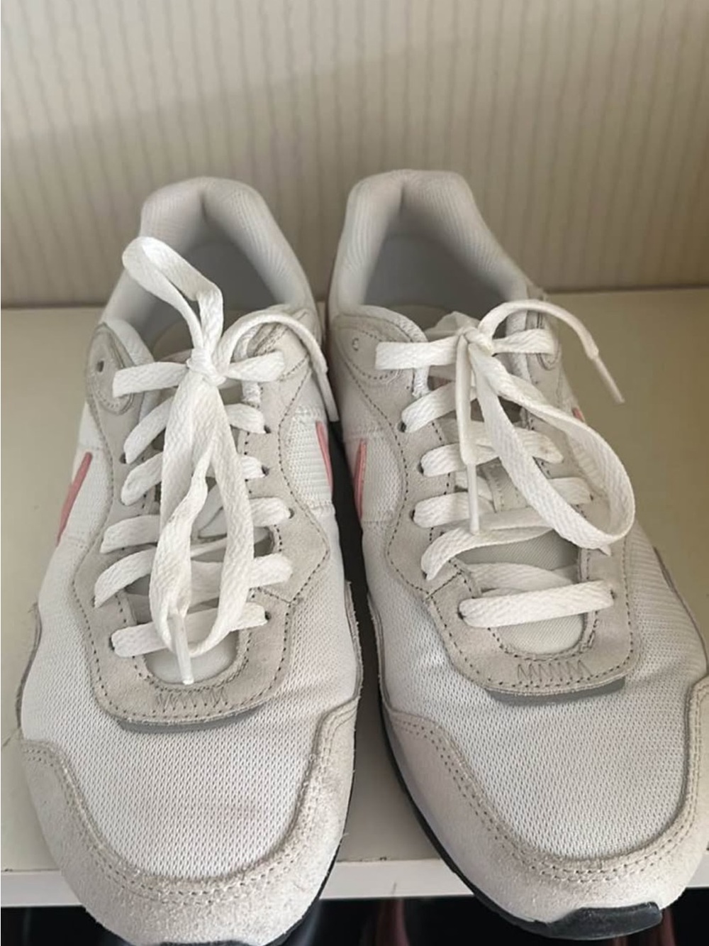 Nike White Sneakers with Pink Swoosh Accent
